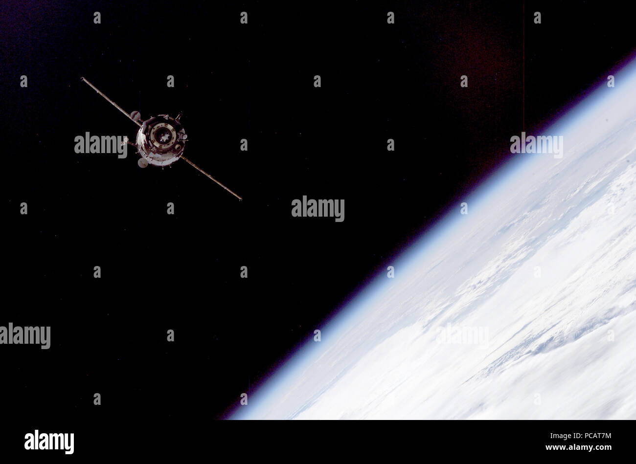 This picture of a distant Soyuz TMA-3 spacecraft was recorded by one of the Expedition 7 crewmembers aboard the International Space Station (ISS). Stock Photo
