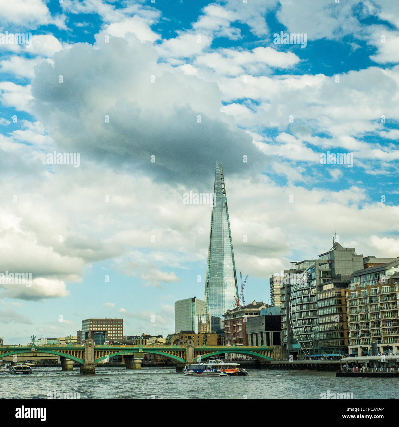 Southwark Bridge over the River Thames with The Shard behind. Stock Photo