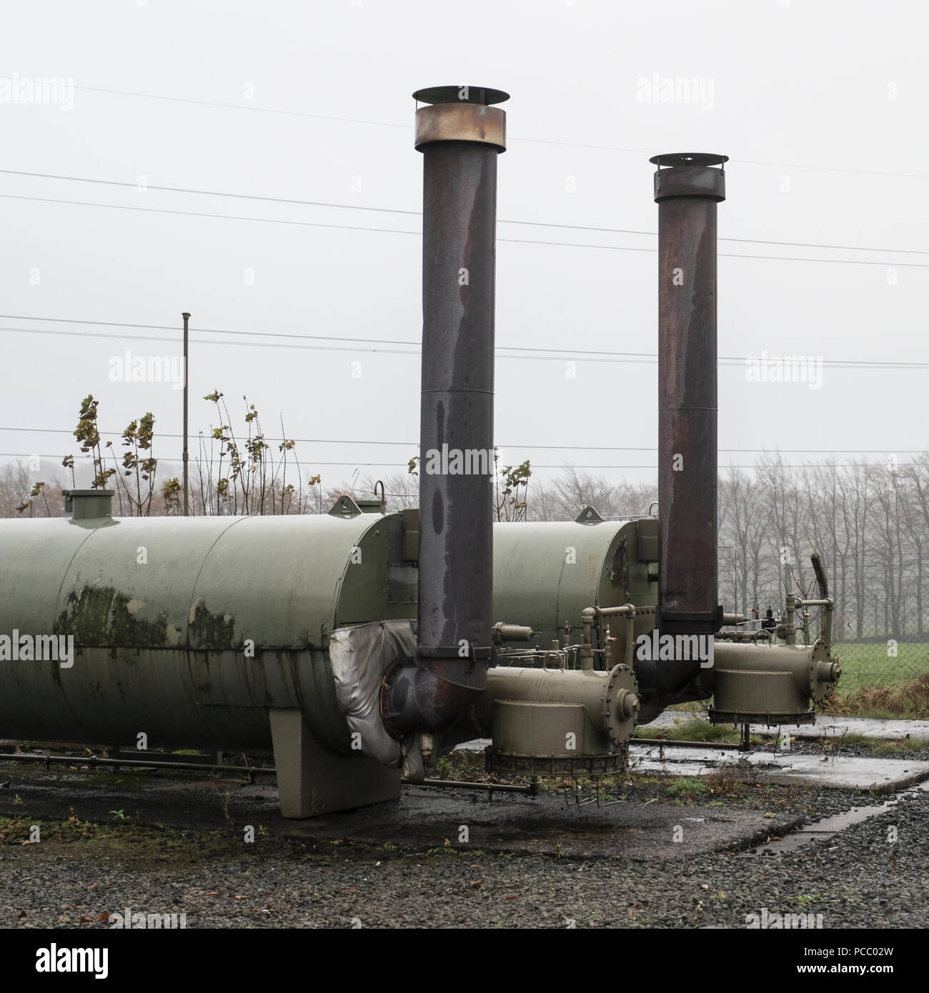 Twin boilers outdoors heat source energy oil gas kilbarcha Stock Photo