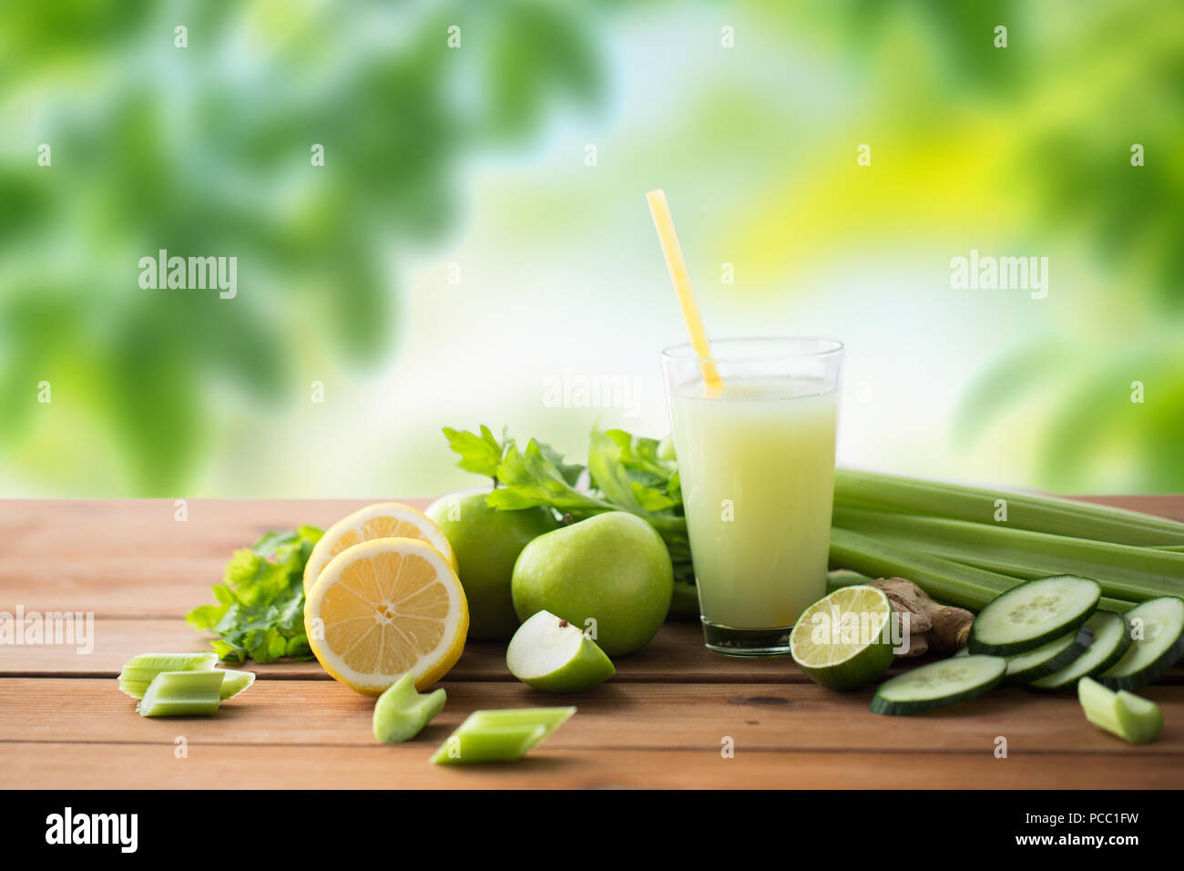 glass of green juice with fruits and vegetables Stock Photo Alamy