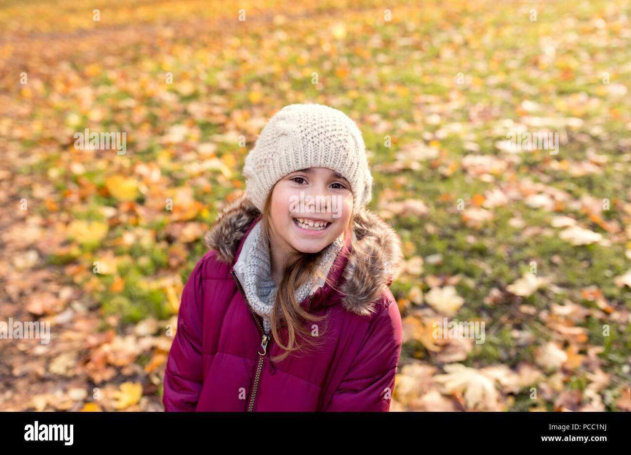 happy beautiful little girl at autumn park Stock Photo - Alamy