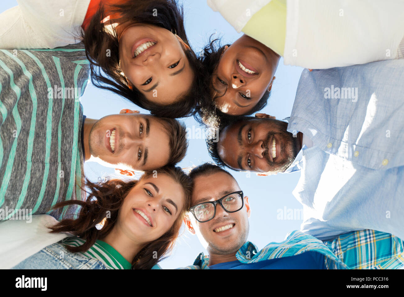 happy smiling friends outdoors standing in circle Stock Photo - Alamy