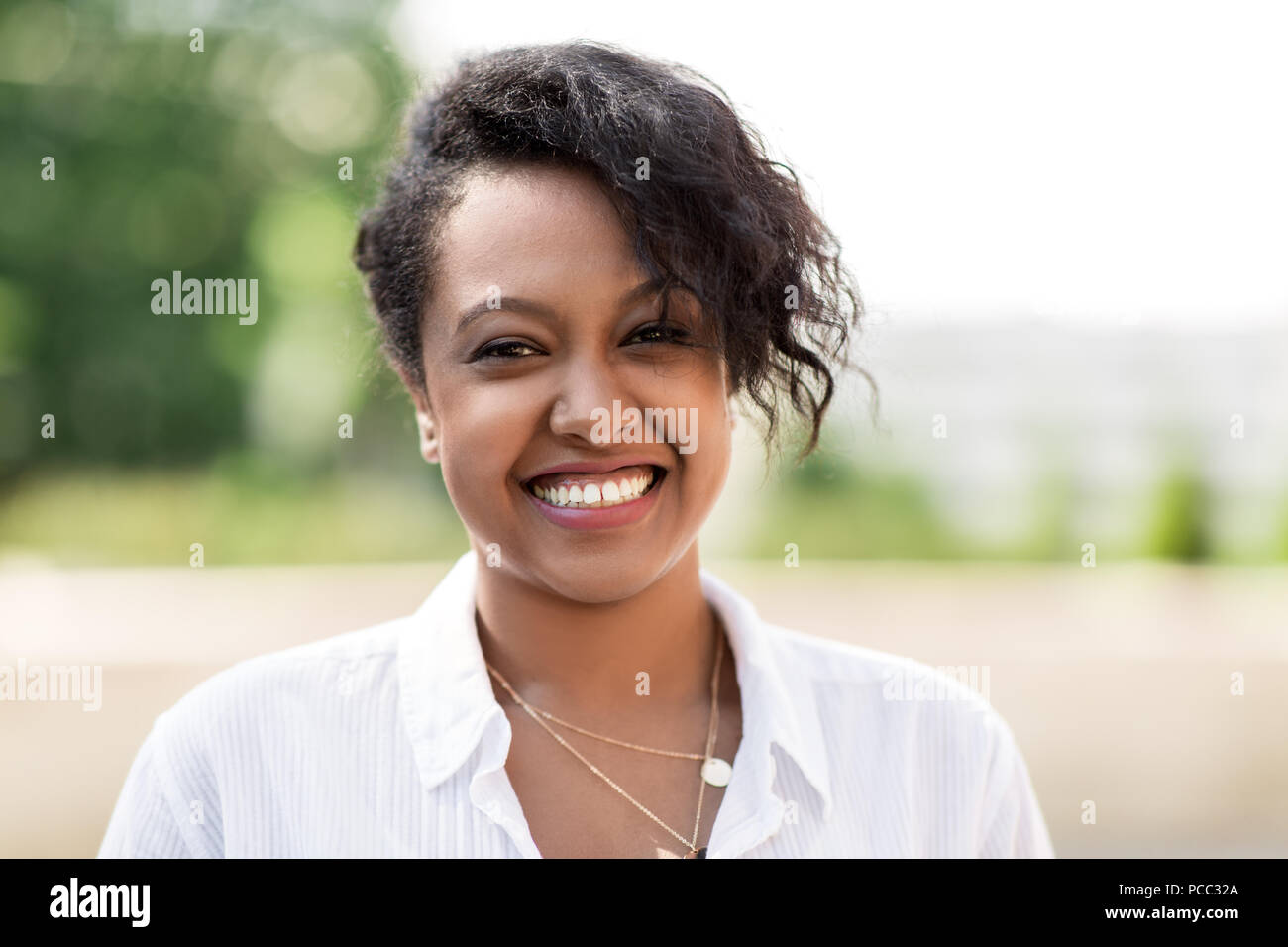 happy african american young woman outdoors Stock Photo - Alamy