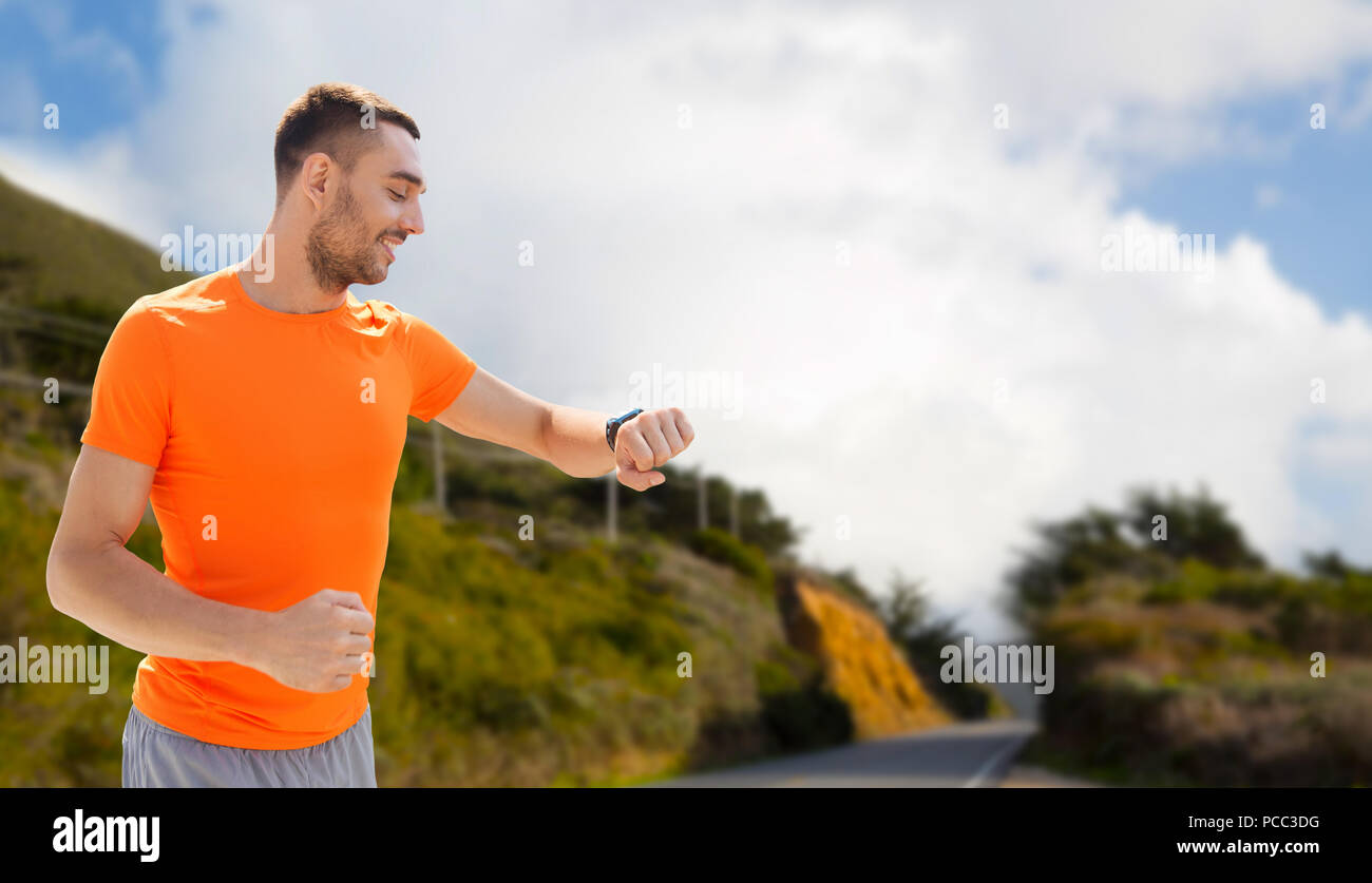 man with smart watch or fitness tracker Stock Photo