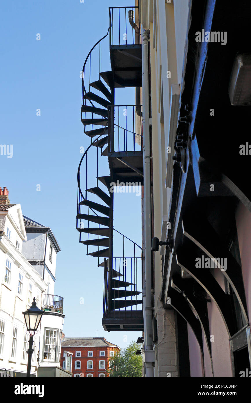 External fire escape stairs not reaching the ground in the City centre of Norwich, Norfolk, England, United Kingdom, Europe. Stock Photo