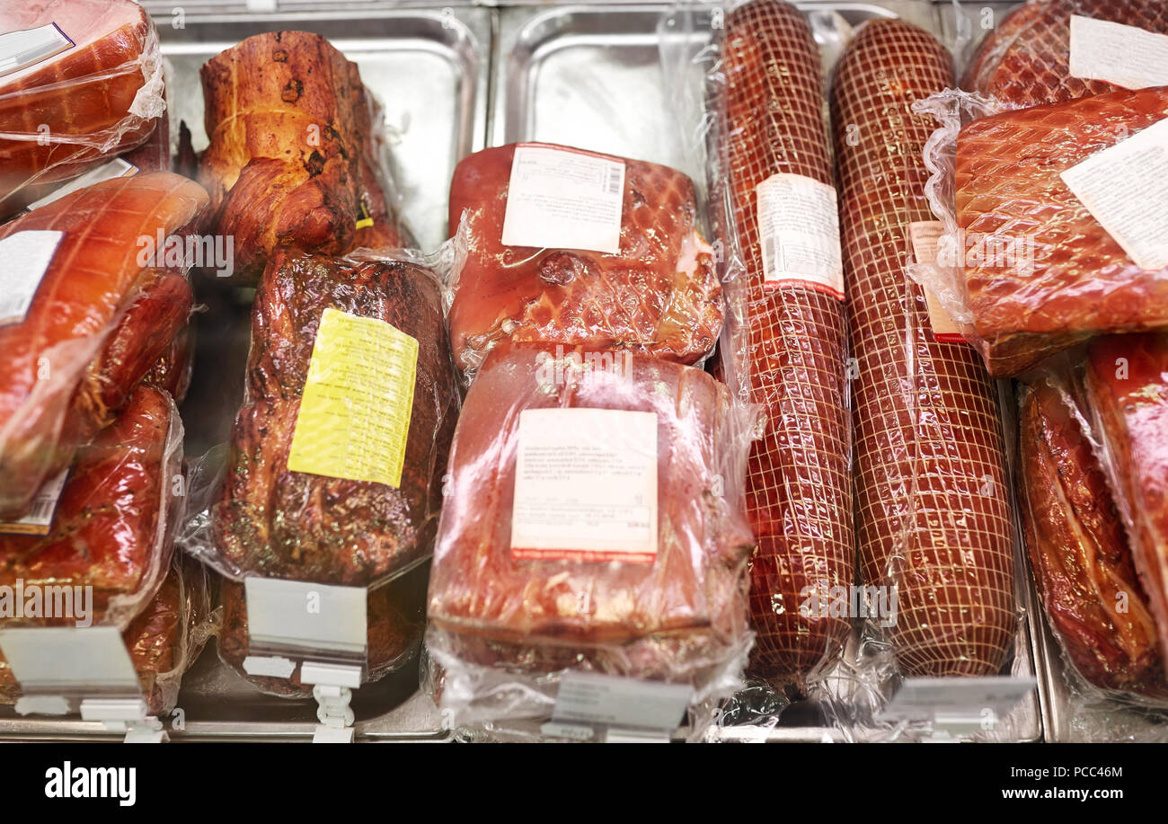 ham at grocery store stall Stock Photo Alamy