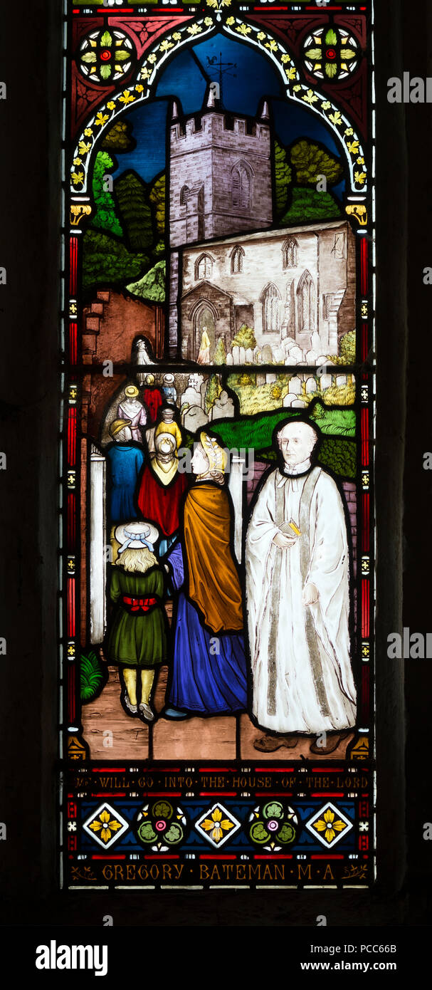 Vicar and congregation stained glass in St. Denys Church, Cold Ashby, Northamptonshire, England, UK Stock Photo