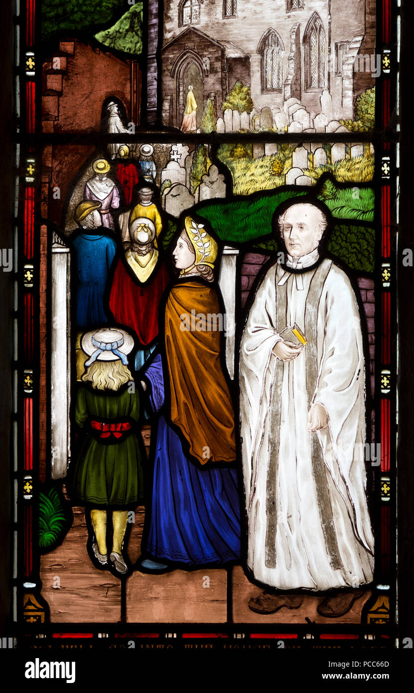 Vicar and congregation stained glass in St. Denys Church, Cold Ashby, Northamptonshire, England, UK Stock Photo