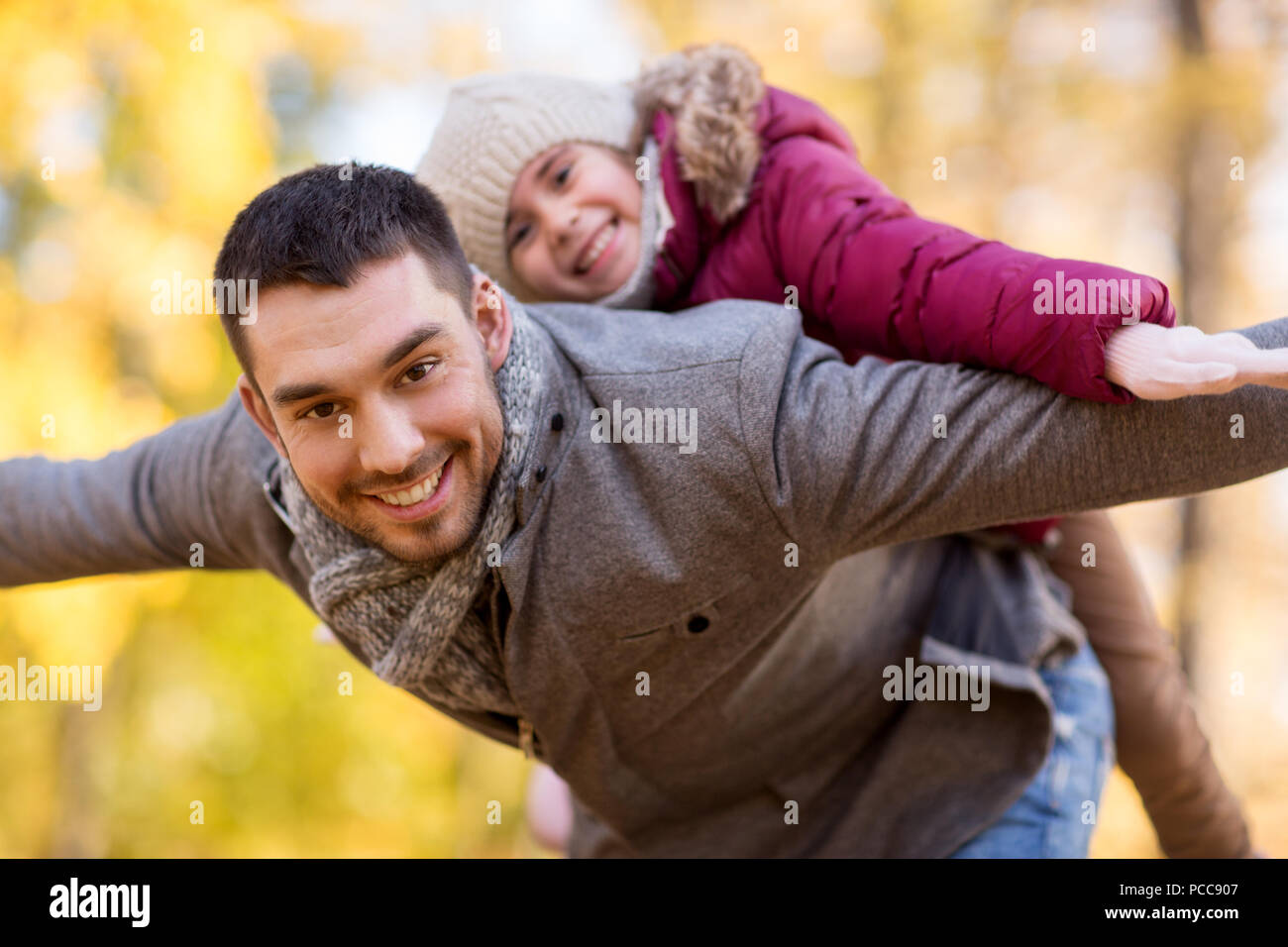 happy father and daughter playing at autumn park Stock Photo - Alamy