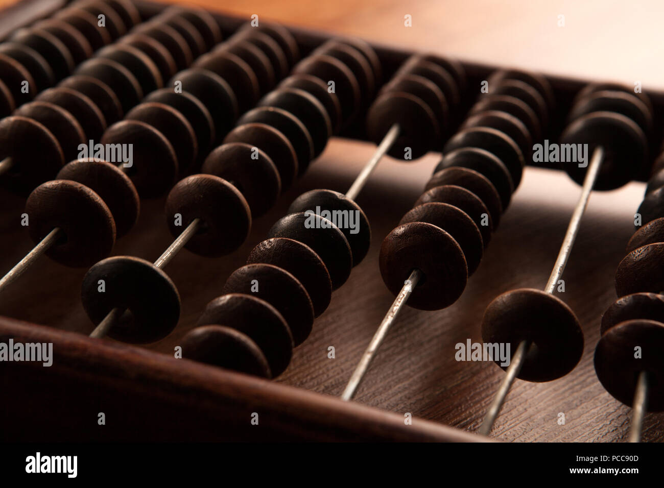 big antique abacus on a wooden table close up Stock Photo