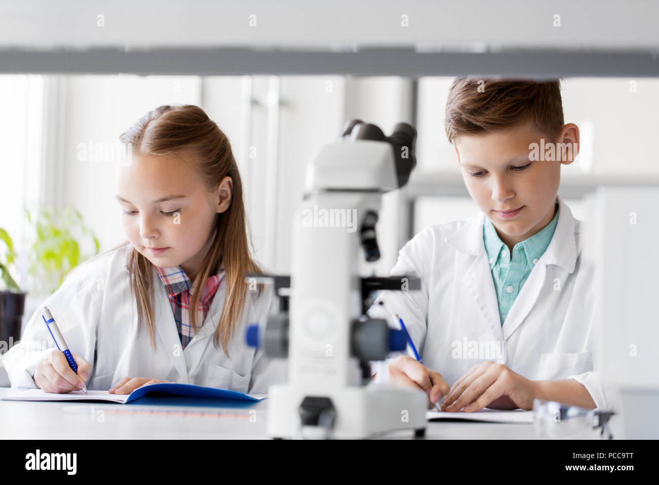 Kids Studying Chemistry At School Laboratory Stock Photo - Alamy