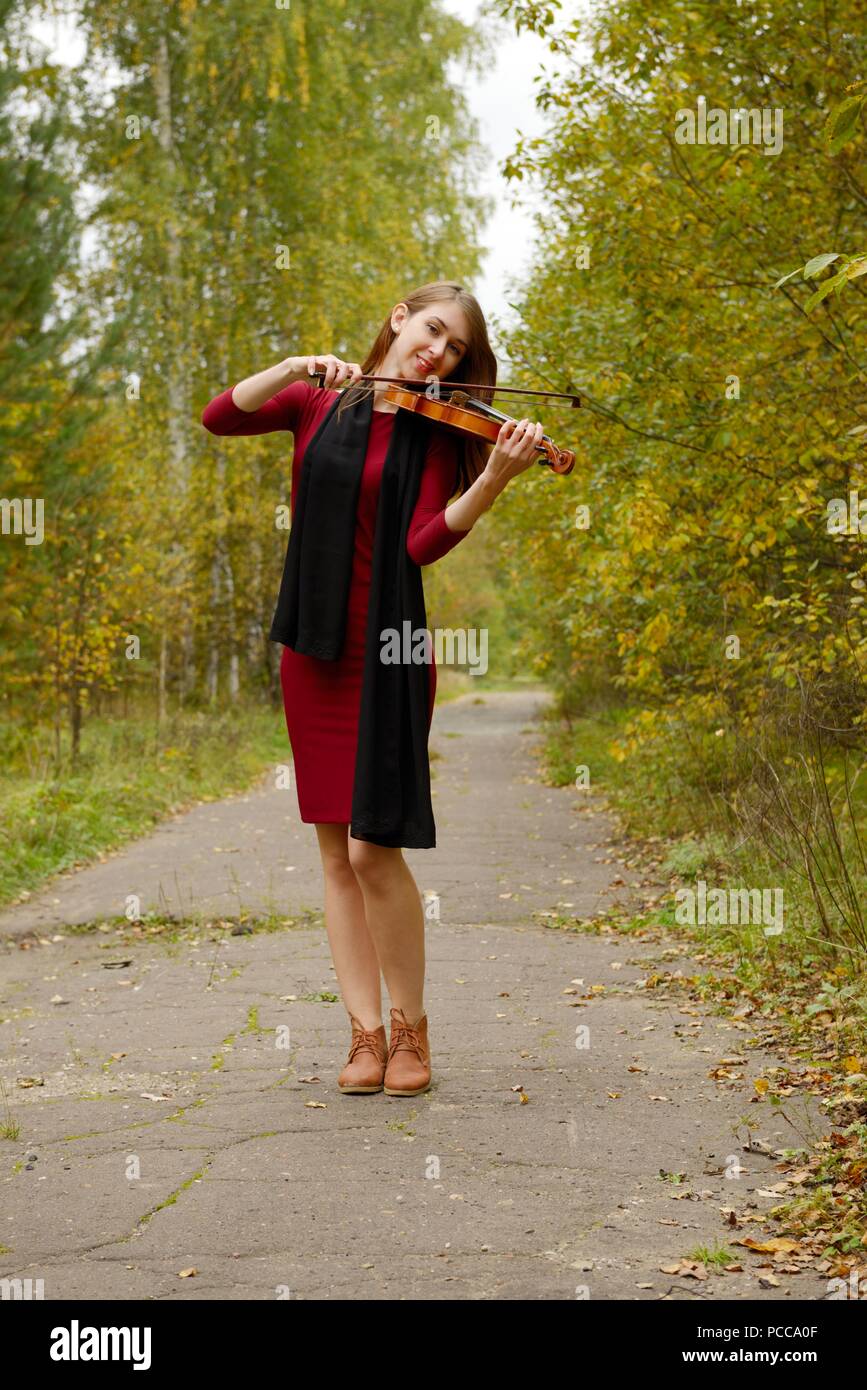 Beautiful girl with violin Stock Photo - Alamy
