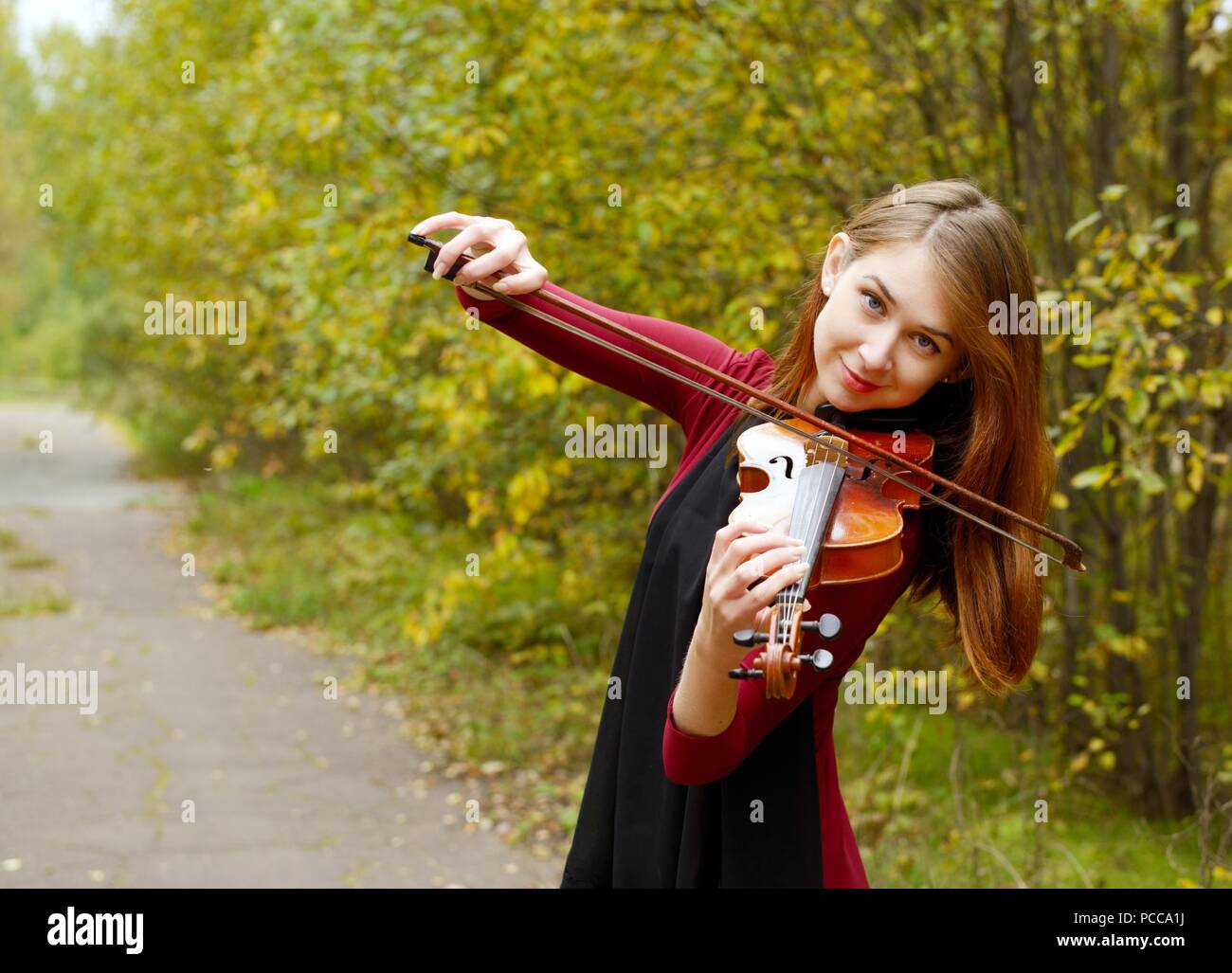 Beautiful girl with violin Stock Photo - Alamy