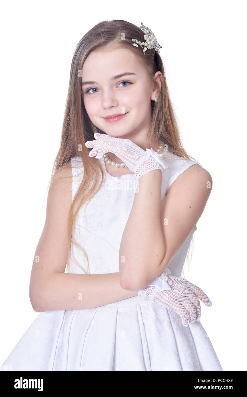 Happy little girl in beautiful white dress posing Stock Photo - Alamy