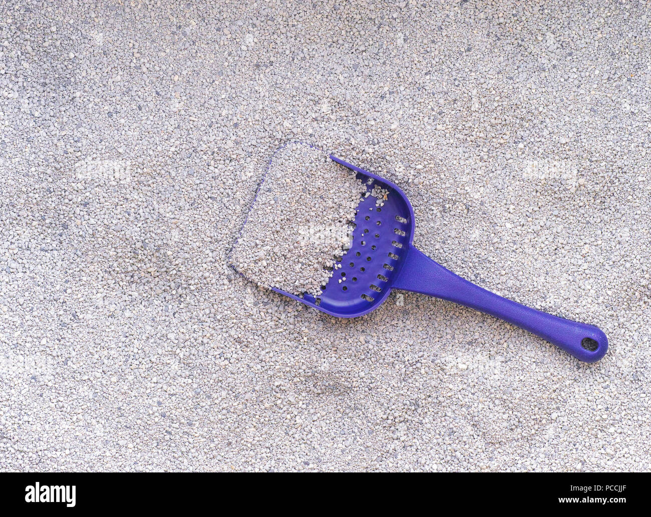 Cat litter with scoop. Close up. Stock Photo