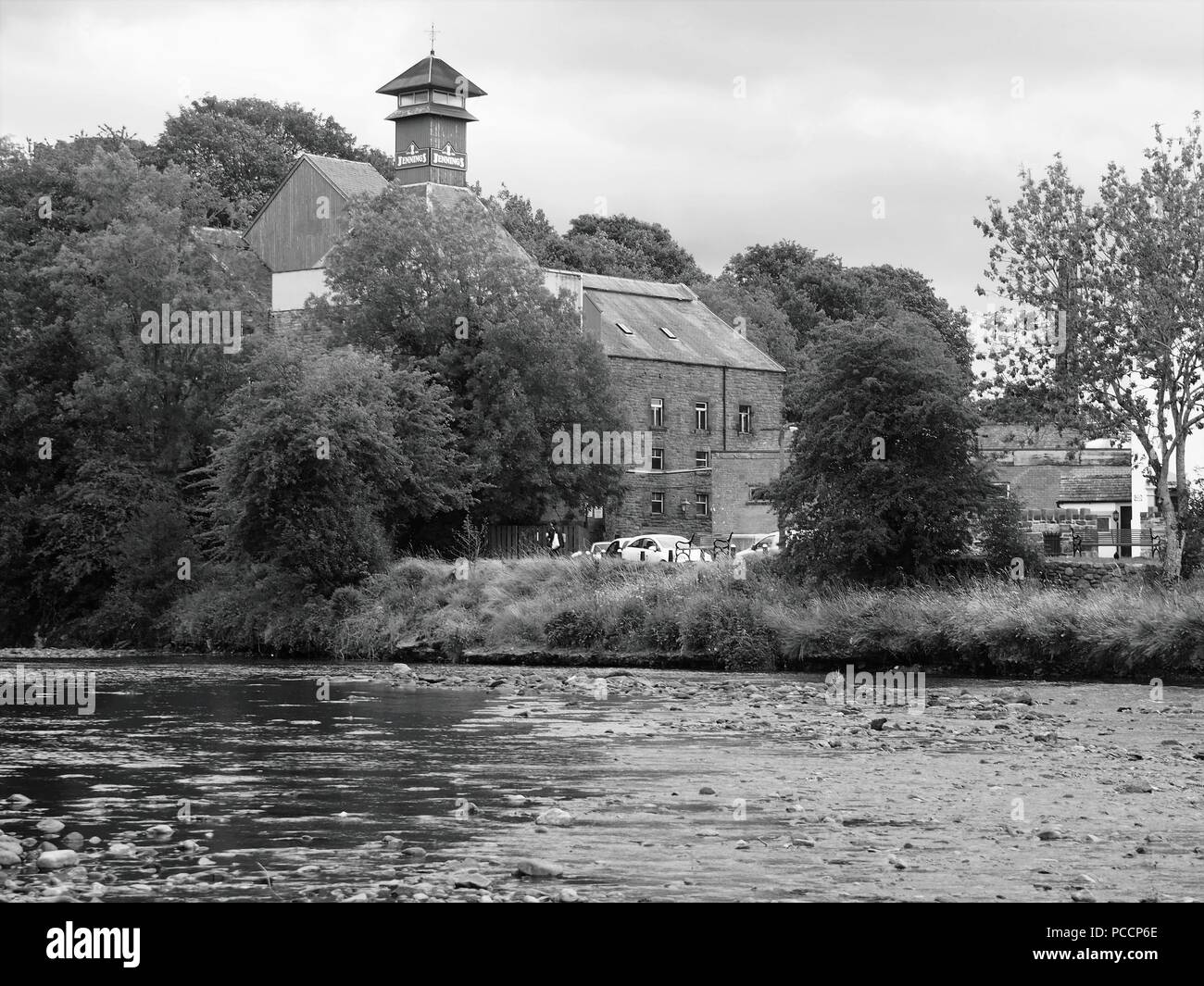 The Buildings of Jennings Brewery from across the River Derwent, Cockermouth, Cumbria, United Kingdom Stock Photo