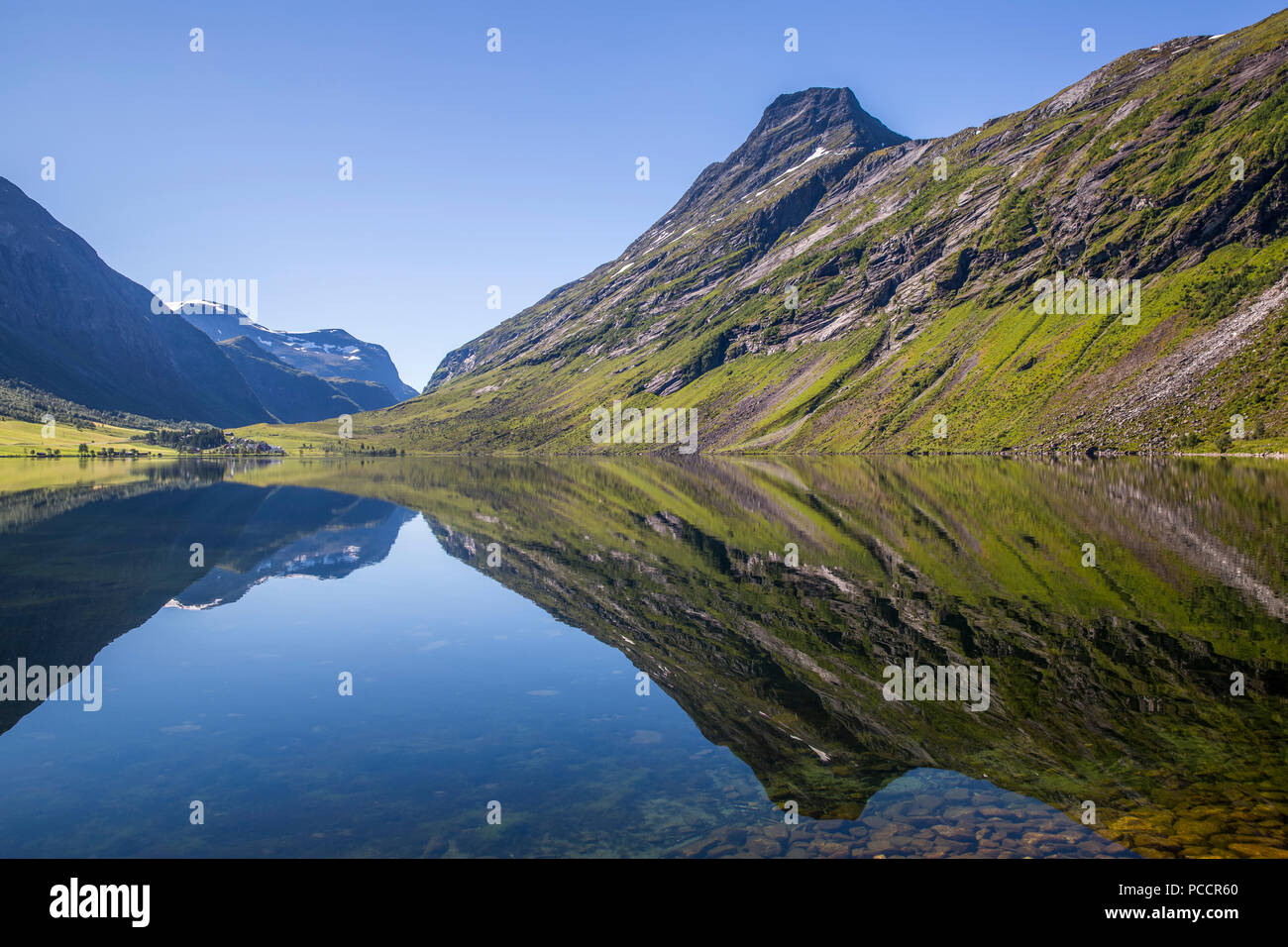 Beautiful reflection of mountains in the waters of Eidsvatnet lake Stock Photo