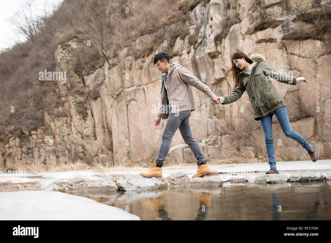 Happy young Chinese couple enjoying winter outing Stock Photo