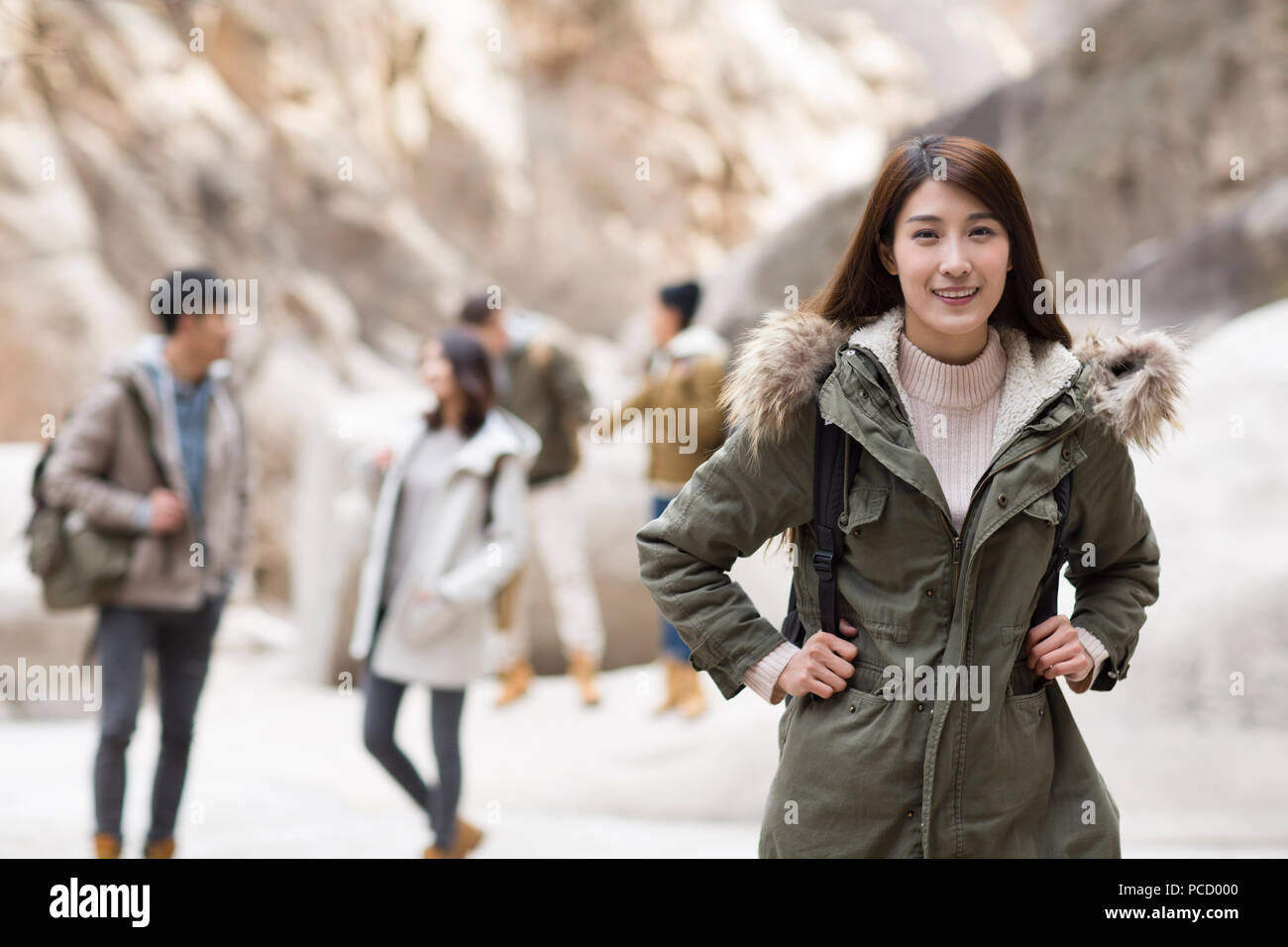 Portrait of cheerful young Chinese woman outdoors in winter Stock Photo