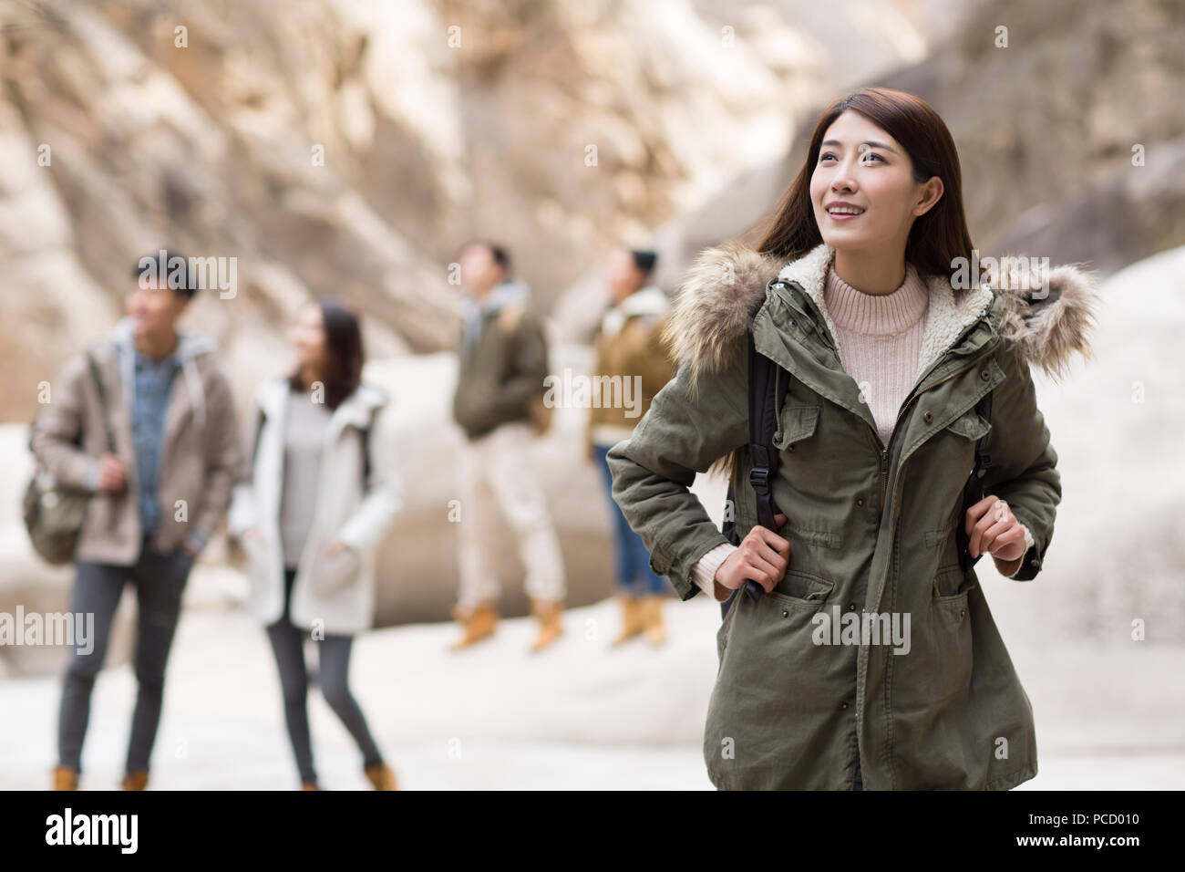 Happy young Chinese friends enjoying winter outing Stock Photo