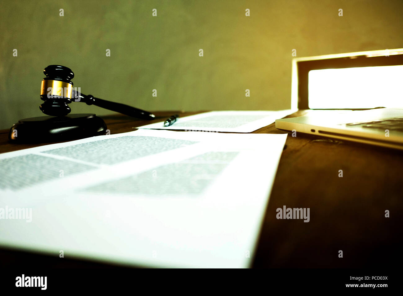 Lawyer desktop , workspace with laptop,gavel,paper and pen on the wood table. Stock Photo