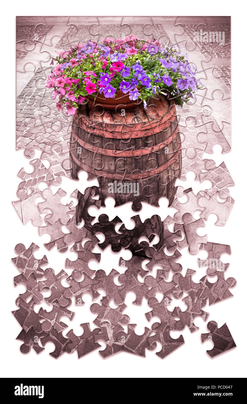 Learn gardening a little by little - Wooden barrel with flowerpot in puzzle shape Stock Photo