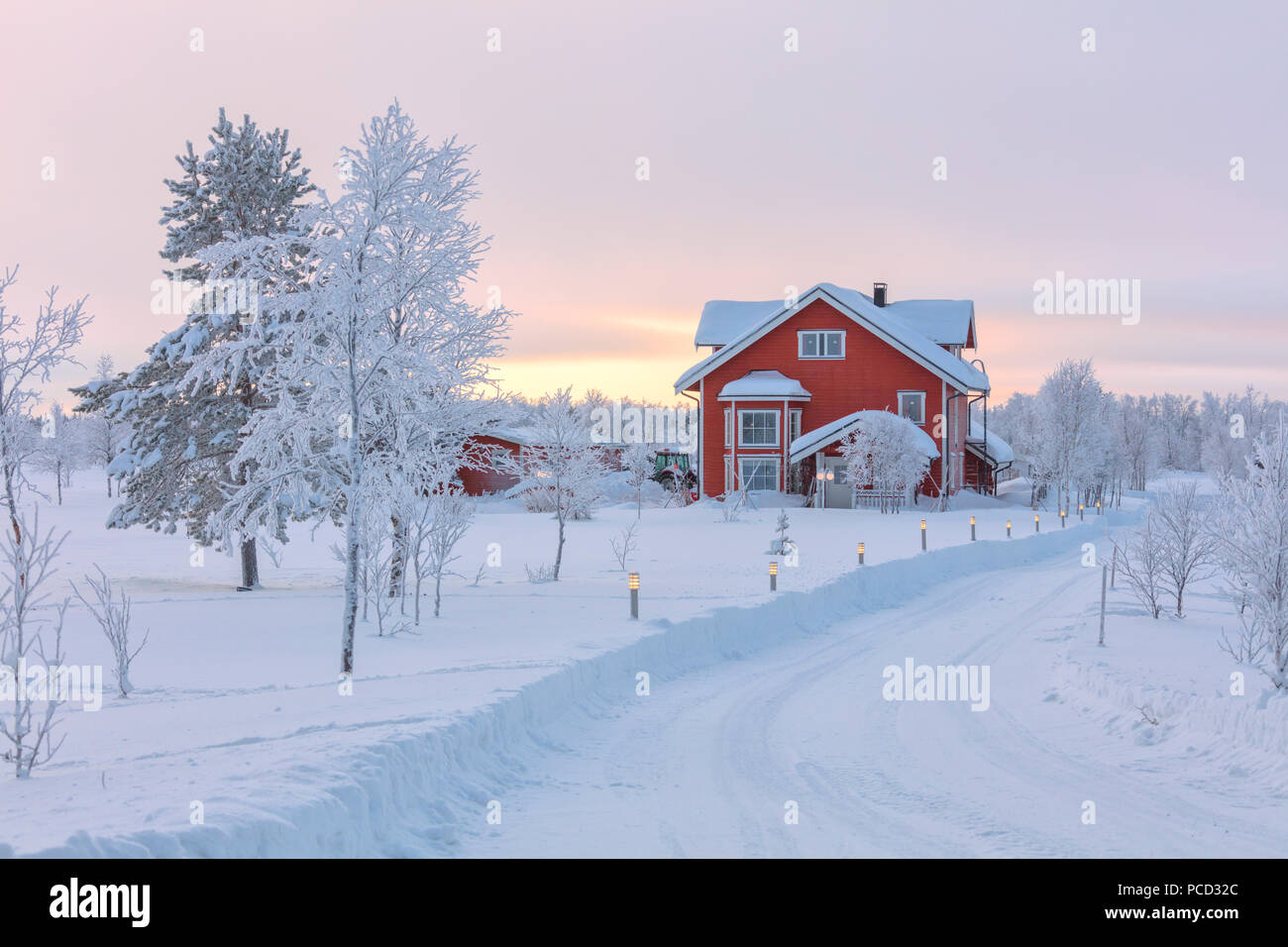Typical house in the snowy forest, Muonio, Lapland, Finland, Europe Stock Photo