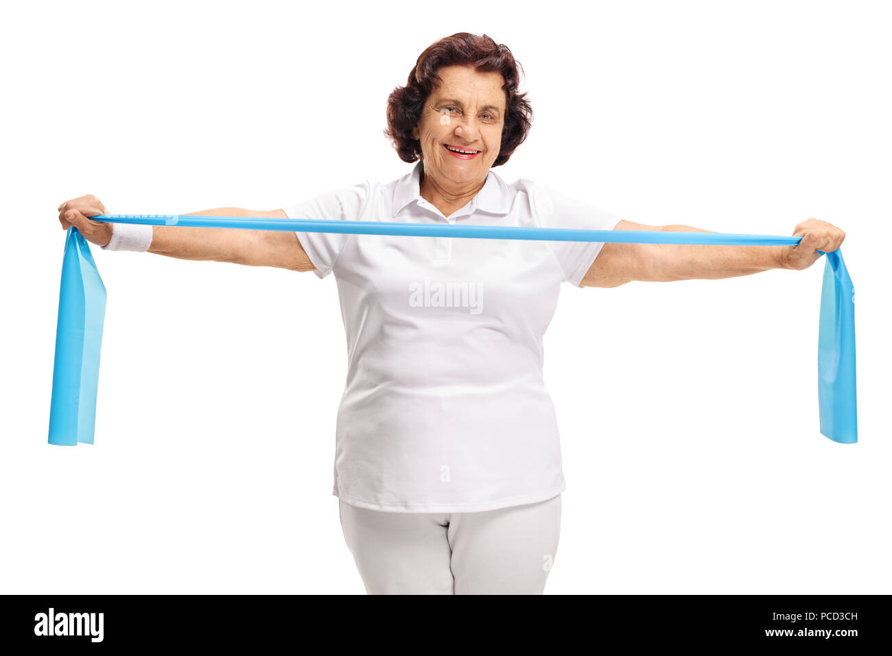 Elderly woman exercising with a rubber band isolated on white background Stock Photo