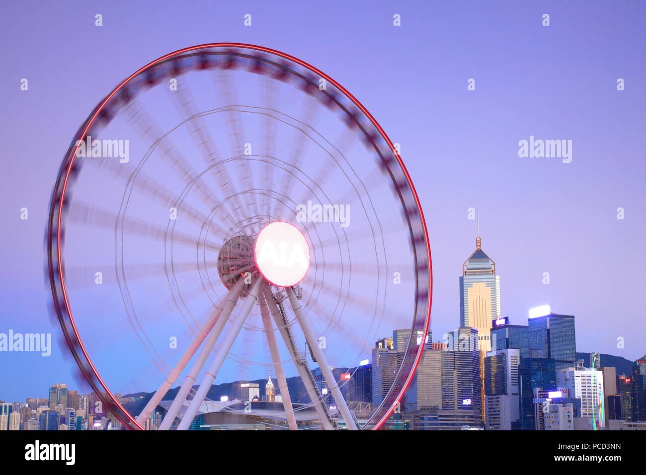 Hong Kong cityscape with The Hong Kong Observation Wheel at dusk, Hong Kong, China, Asia Stock Photo