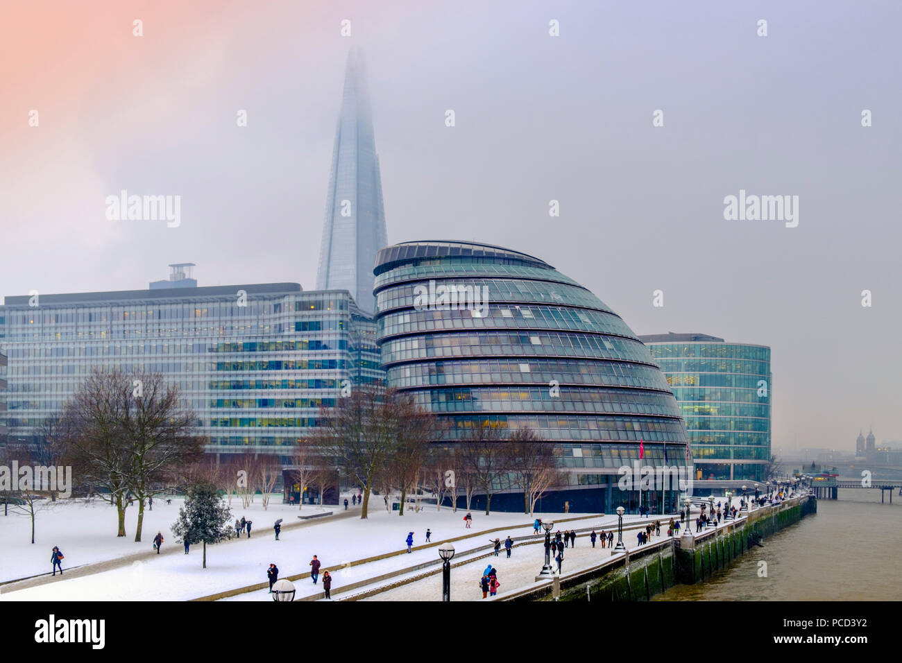 The South Bank of the River Thames showing the Shard and City Hall, HQ of the Mayor of London, in snow, London, England, United Kingdom, Europe Stock Photo