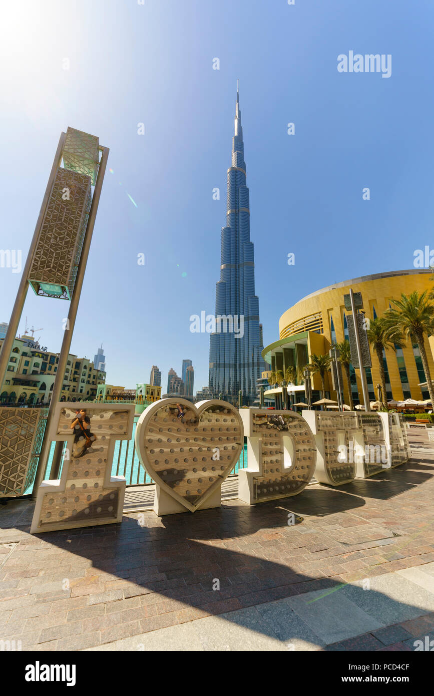 Burj Khalifa and I Love Dubai sign by the Lake, Downtown, Dubai, United Arab Emirates, Middle East Stock Photo