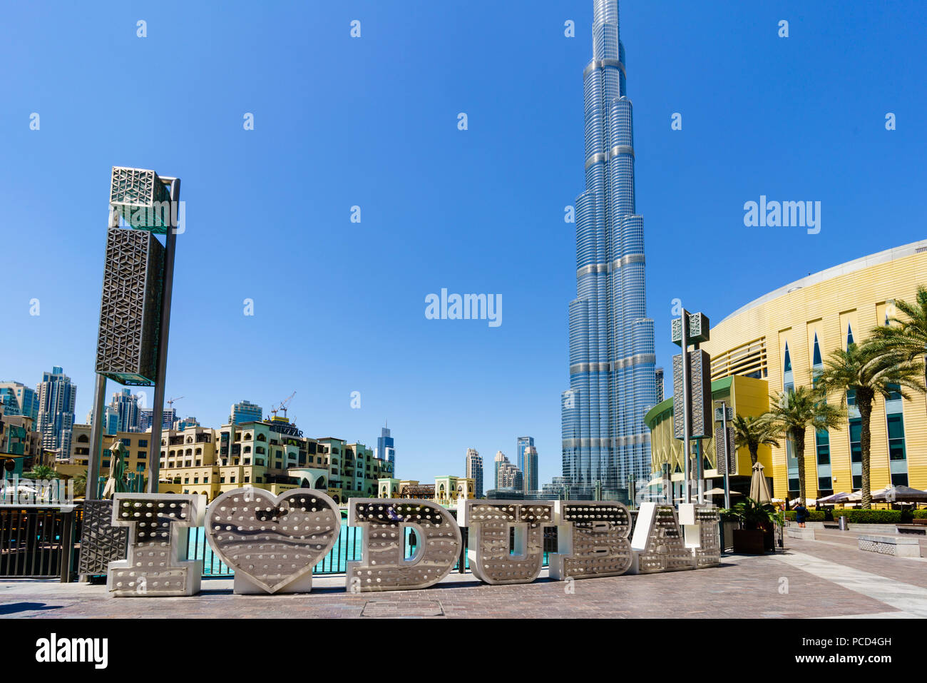 Burj Khalifa and I Love Dubai sign by the Lake, Downtown, Dubai, United Arab Emirates, Middle East Stock Photo