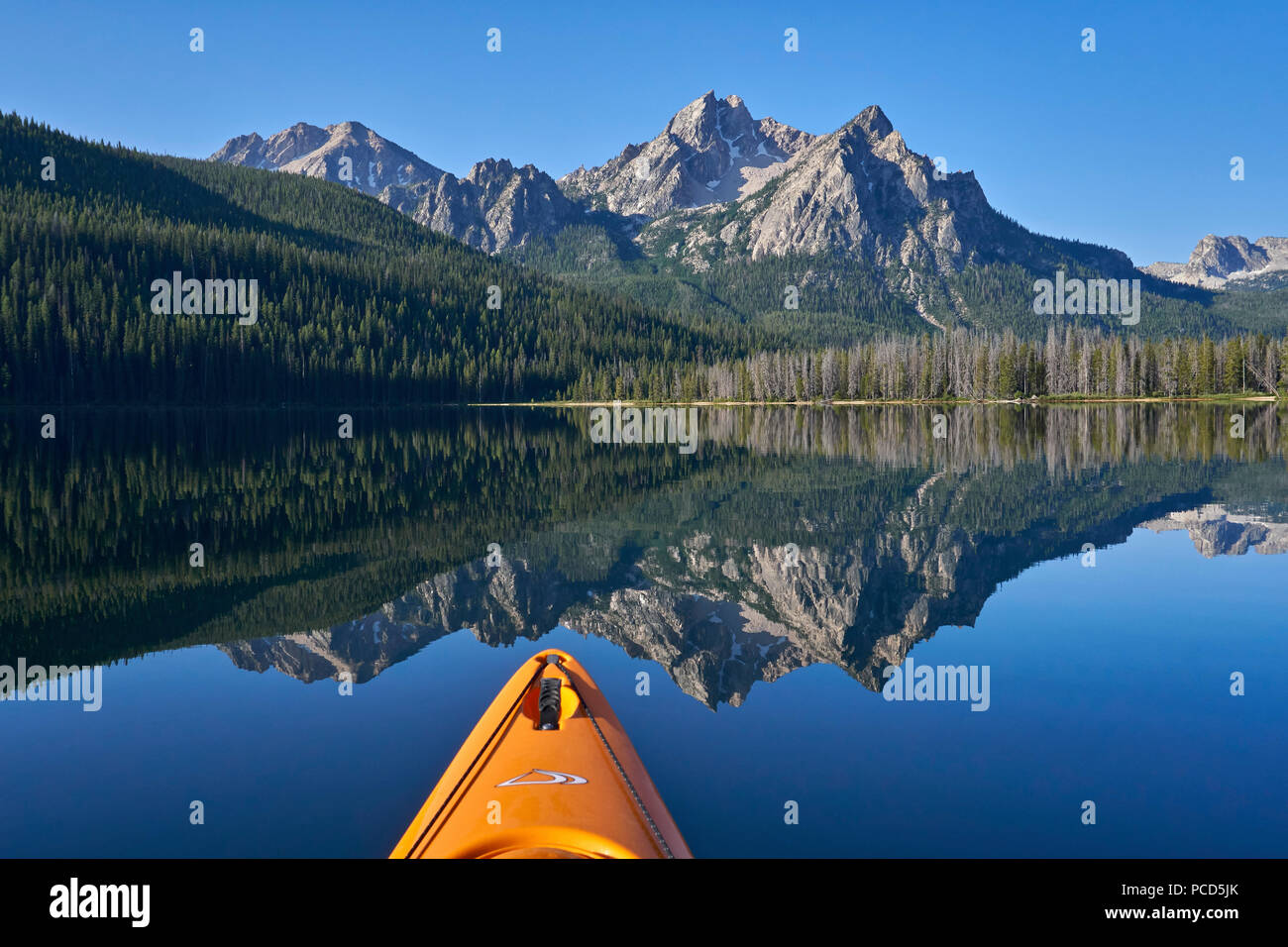 McGown Peak reflected in Stanley Lake while kayaking, Sawtooth National Recreation Area, Idaho, United States of America, North America Stock Photo