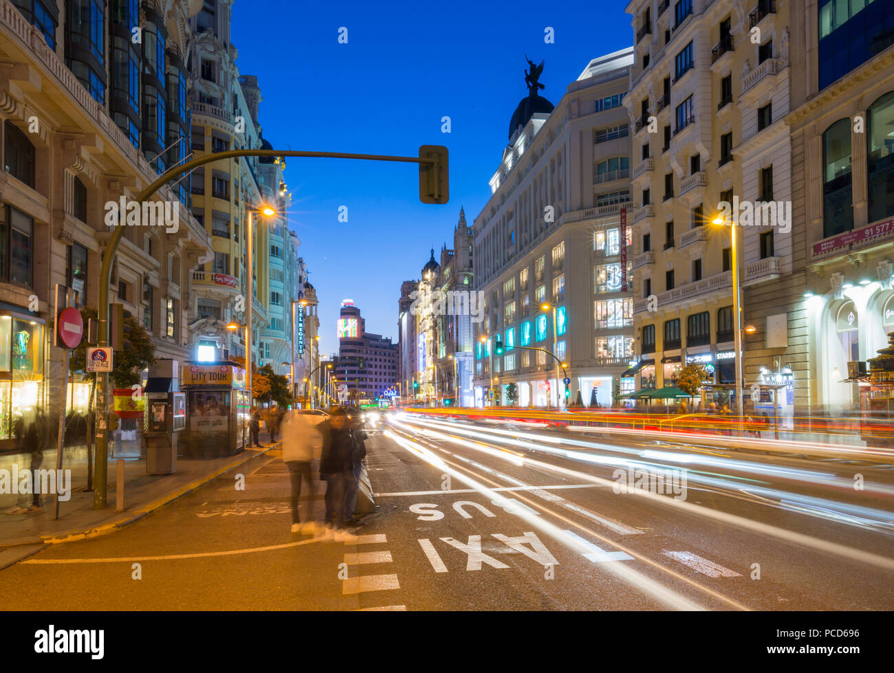 View of architecture and trail lights on Gran Via at dusk, Madrid, Spain, Europe Stock Photo