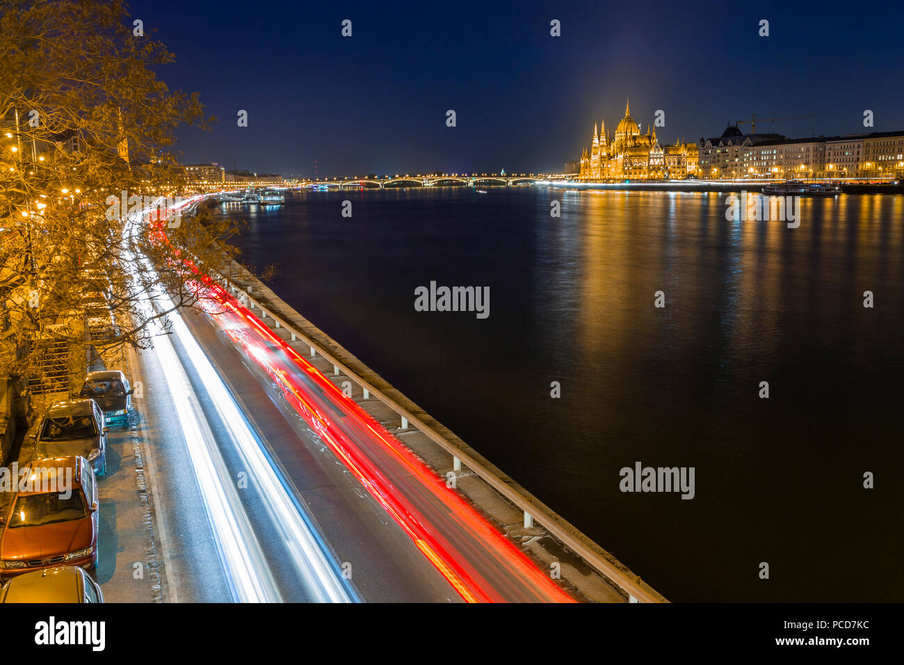 Trail lights along River Danube and Hungarian Parliament Building at night, Budapest, Hungary, Europe Stock Photo