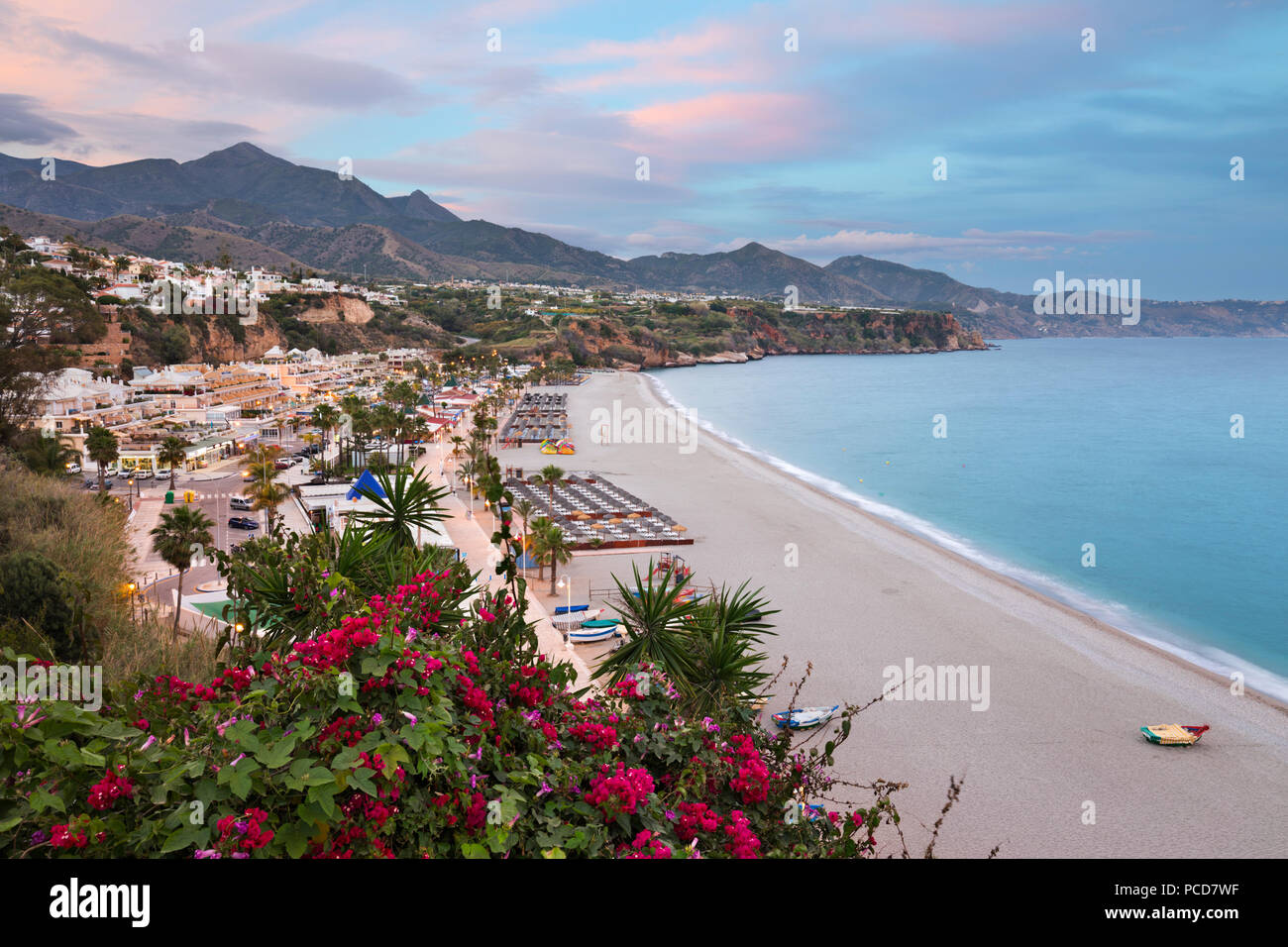 Sunset view over Nerja Playa Burriana beach, Nerja, Malaga Province, Costa del Sol, Andalucia, Spain, Europe Stock Photo