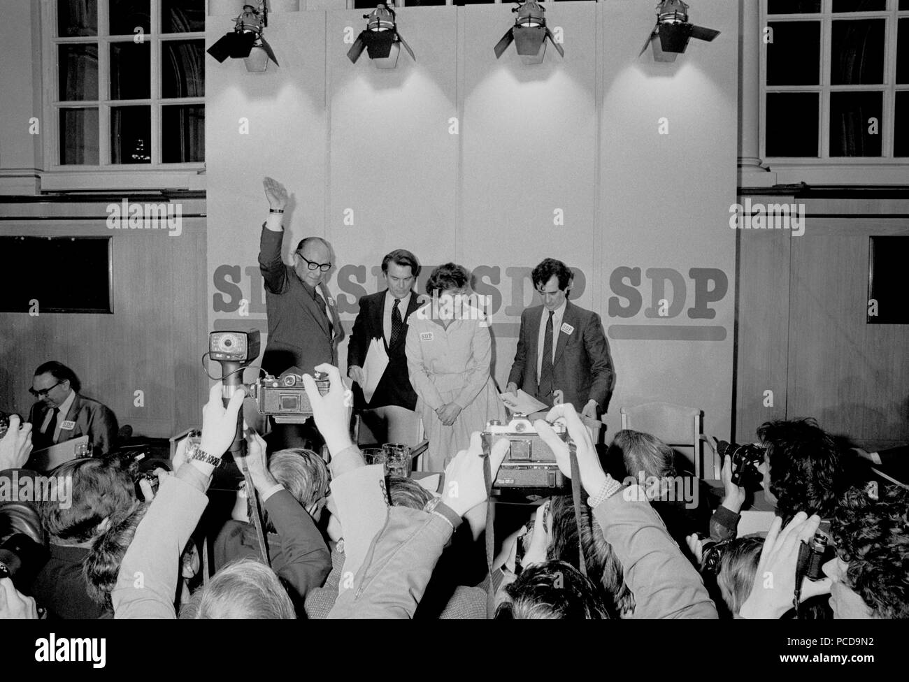 (L-R) Roy Jenkins, Nicholas Owen, Shirley Williams and Bill Rodgers face the cameras after the breakfast-time launching of the new Social Democratic Party at the Connaught Rooms, London. Stock Photo
