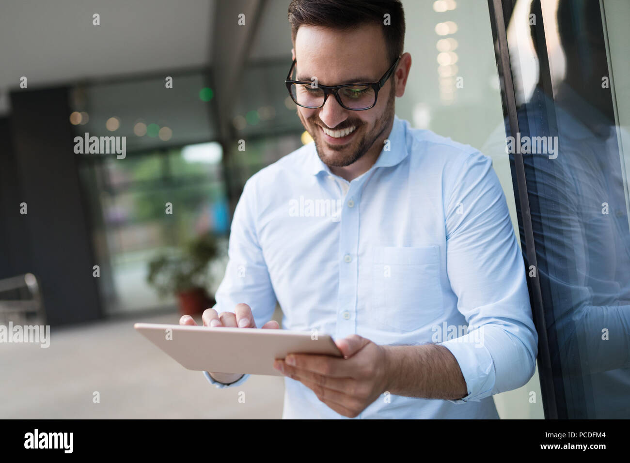 Business man using digital pad hi-res stock photography and images - Alamy