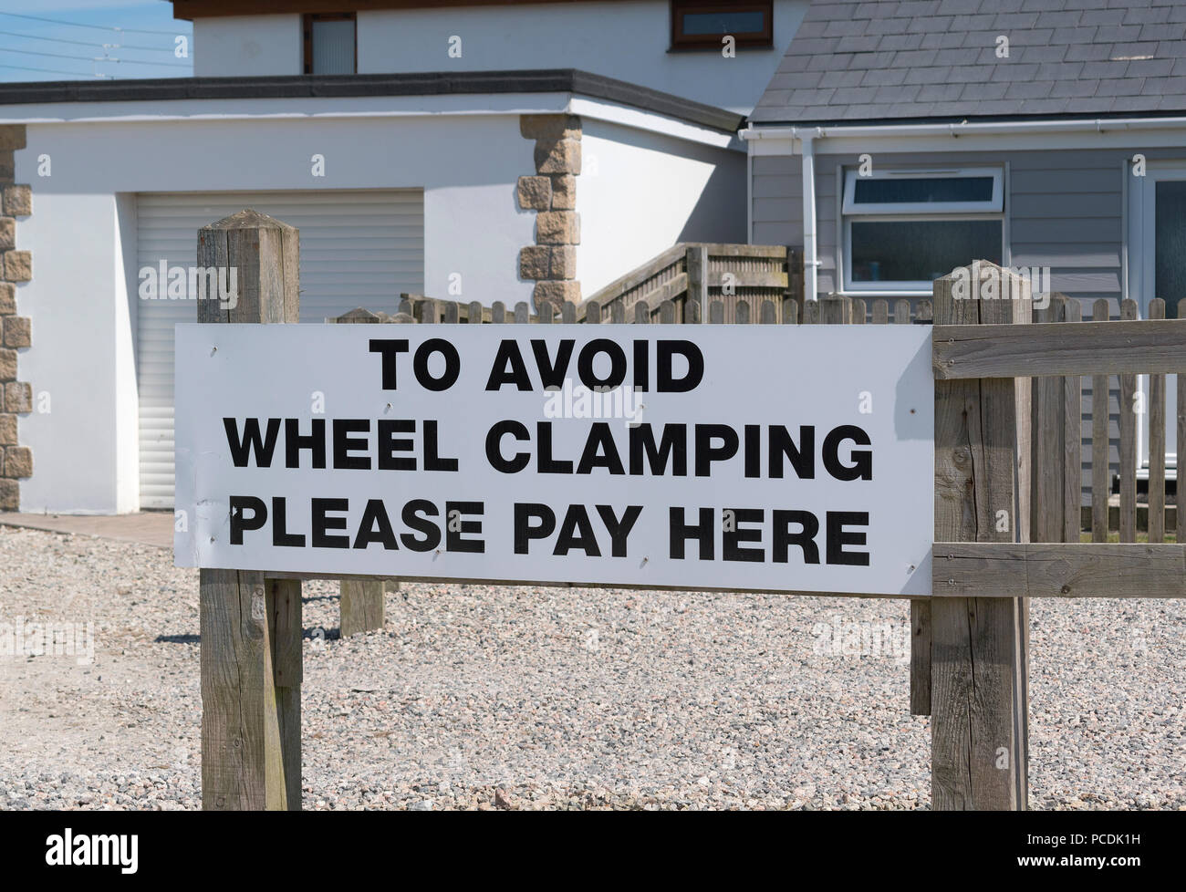 wheel clamping warning sign on private property. Stock Photo