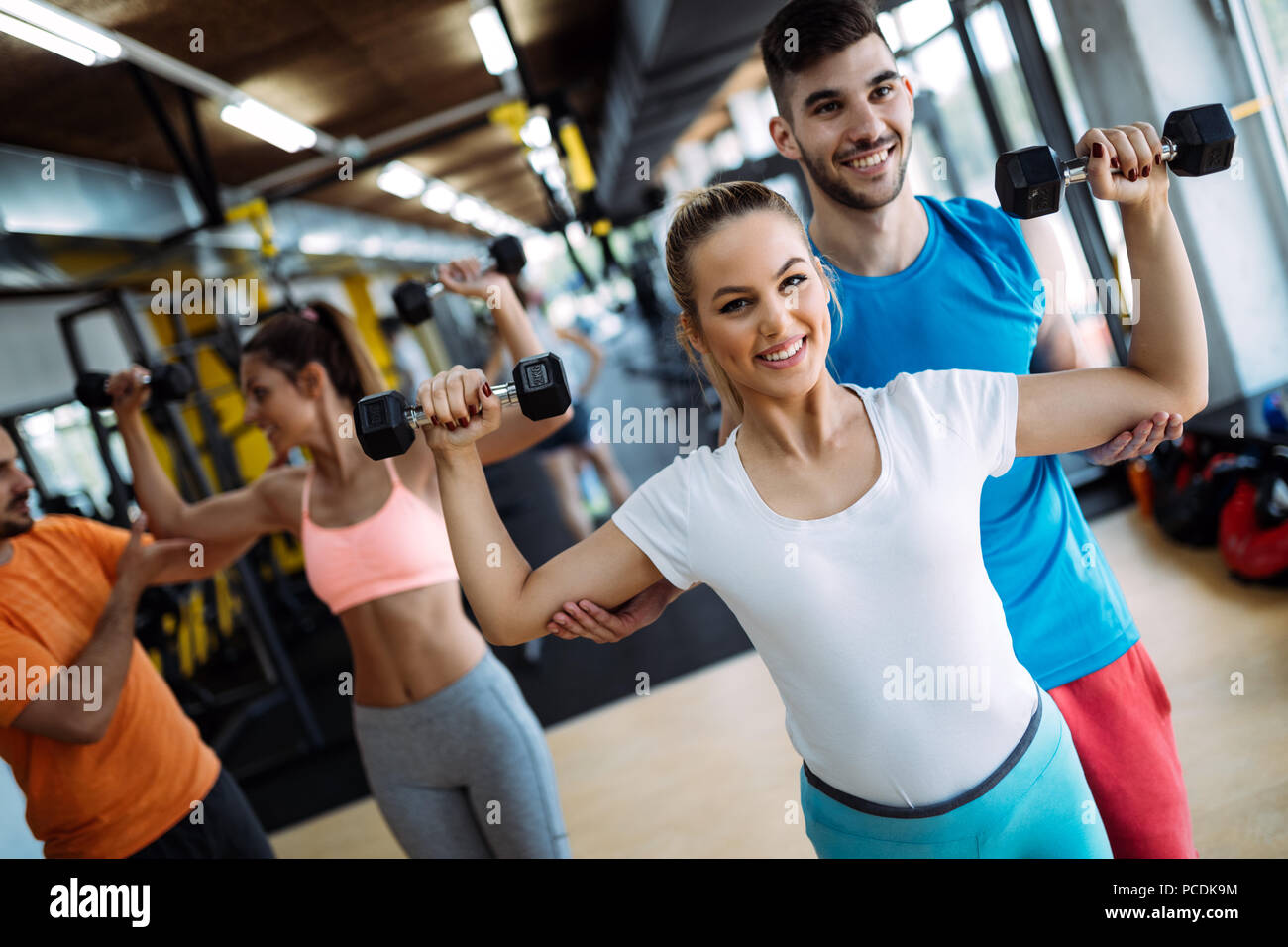 Group of people have workout in gym Stock Photo - Alamy