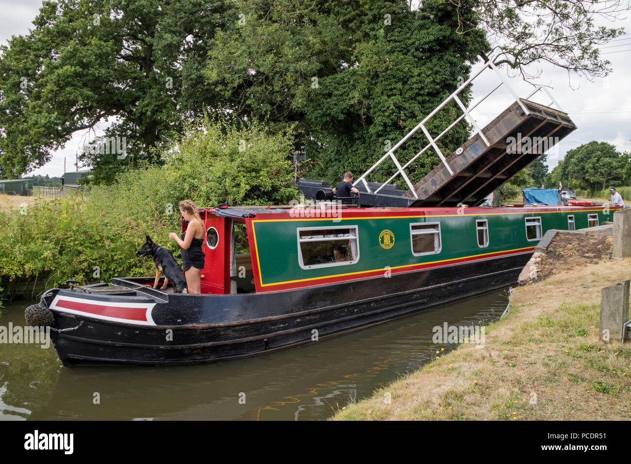 Negotiating the Drawbridge near Hockley Heath on the Stratford upon Avon Canal, Warwickshire, England, UK Stock Photo