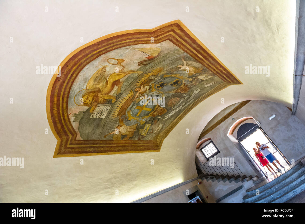 Coat of arms painted onto the curved ceiling in the entrance hall to the captain of the lake home in Malcesine, Italy. Stock Photo