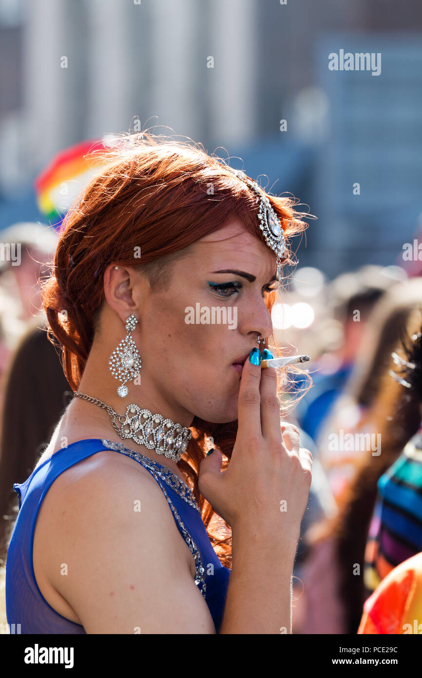 Man in drag smoking a cigarette at the 2018 Liverpool Pride Festival. Stock Photo