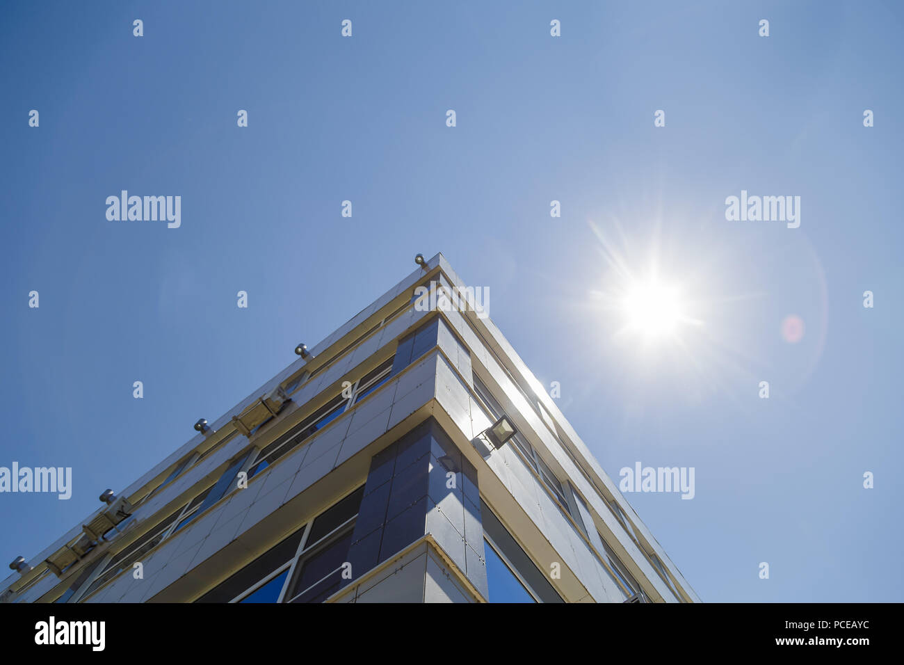 Modern building against the blue sky, modern design Stock Photo - Alamy
