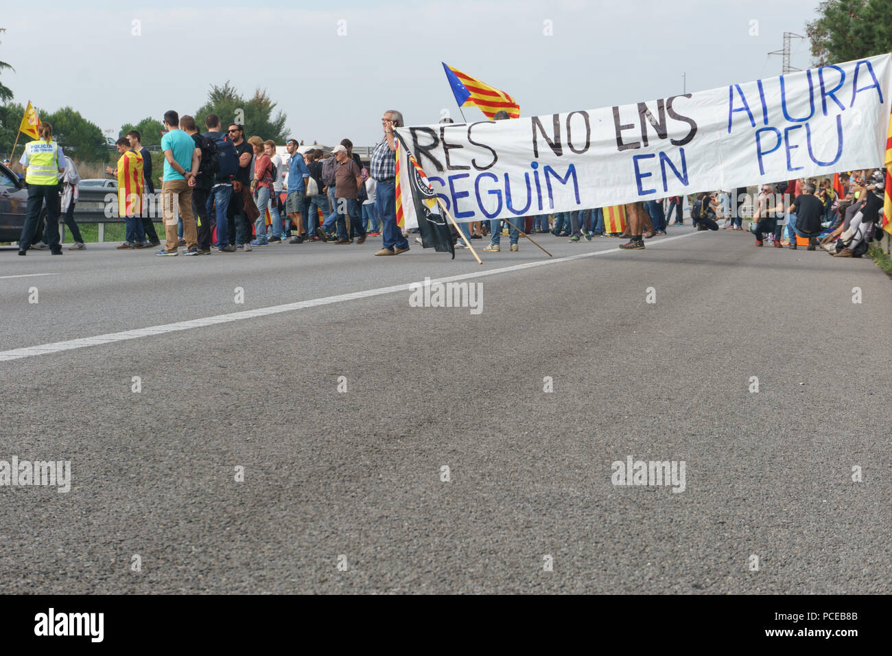 Cardedeu, Catalonia, Spain, October 3, 2017: paceful people cutting off the highway AP-7 in protest for spanish police repression of first october Stock Photo