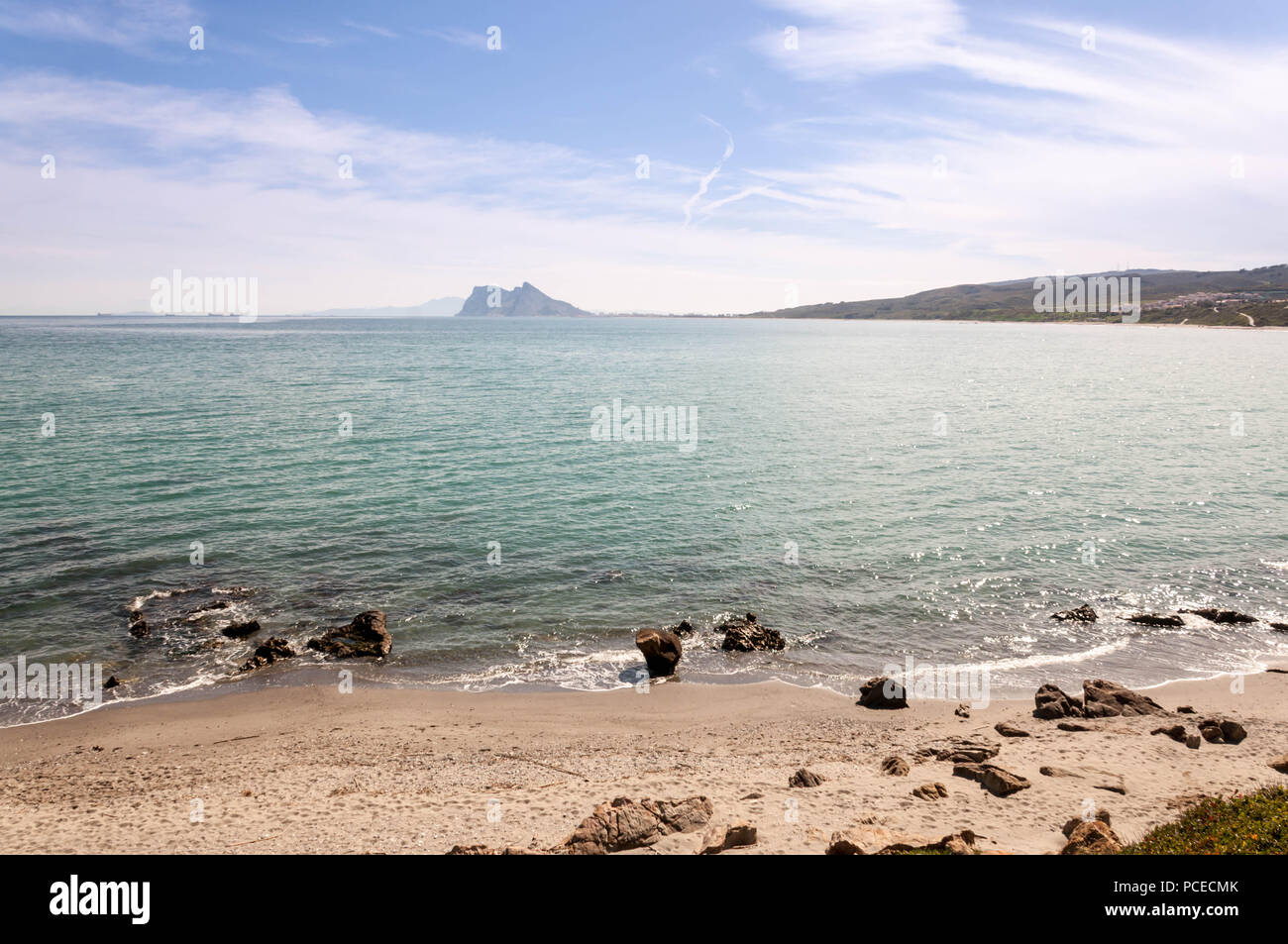 La Alcaidesa Beach with the Rock of Gibraltar and Africa at the horizon Stock Photo