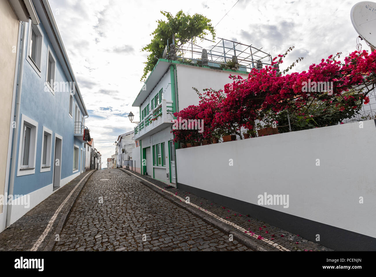 Narrow street with rural houses in Lajes do Pico, Pico island, Azores, Portugal Stock Photo