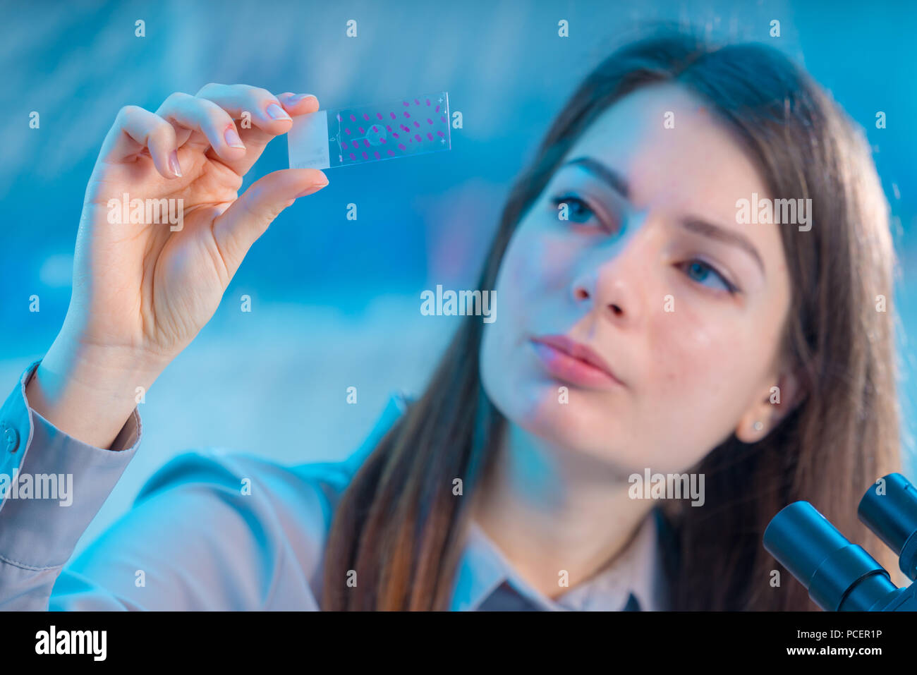 female technician take sample on microscope slide Stock Photo - Alamy