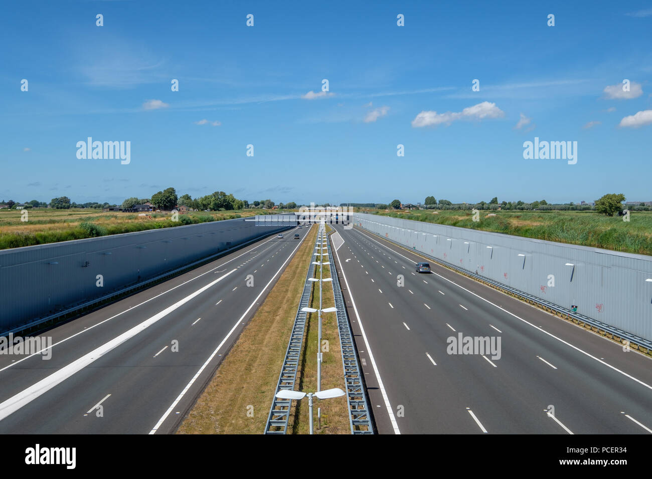 Modern deepered highway A4, Delft-Schiedam, Netherlands. This modern highway is built in a deepened location to save the Midden-Delfland nature reserv Stock Photo