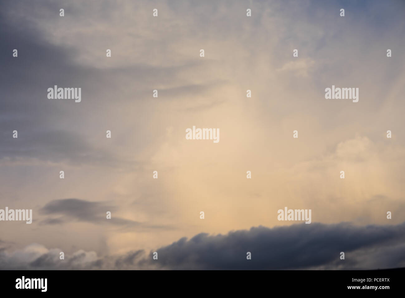 stormy red cloud in the morning with sun rising sunrise and grey rainy